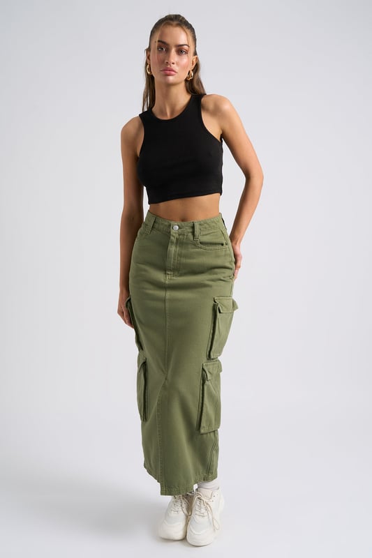 Model is 5'6 and wears a size S. Slim fit. High Waisted. Midi length. Introducing our Khaki Soda Cargo Skirt, a versatile and stylish addition to your wardrobe that effortlessly combines functionality with fashion-forward design. Crafted with attention to detail and quality, this skirt is perfect for those who seek comfort without compromising on style.