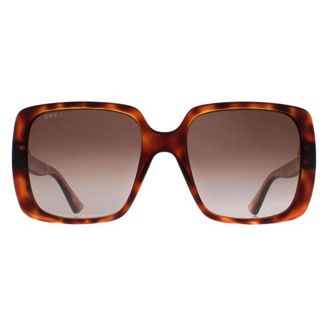 Gucci Square Womens Dark Havana Brown Gradient GG0632S  Sunglasses are a modern square frame that effortlessly complements any outfit. The frame is made from high-quality acetate, renowned for its durability and lightweight nature, ensuring a comfortable fit. Gucci's logo features on the slender temples for brand authenticity.