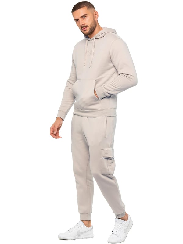 Enzo Mens Overhead Hoodie Tracksuit Set. Regular Fit, Long Sleeve Hoodie with Cuffed Wrists and Adjustable Drawstrings. Features EZ Logo On Chest And Joggers. Regular Fit Cargo Jogger. Elasticated Waistband With Adjustable Drawstring. Features 2 Side Slash Pockets, 2 Cargo Pockets, Single Welt Back Pocket. Ideal to use for Casual and Work wear.