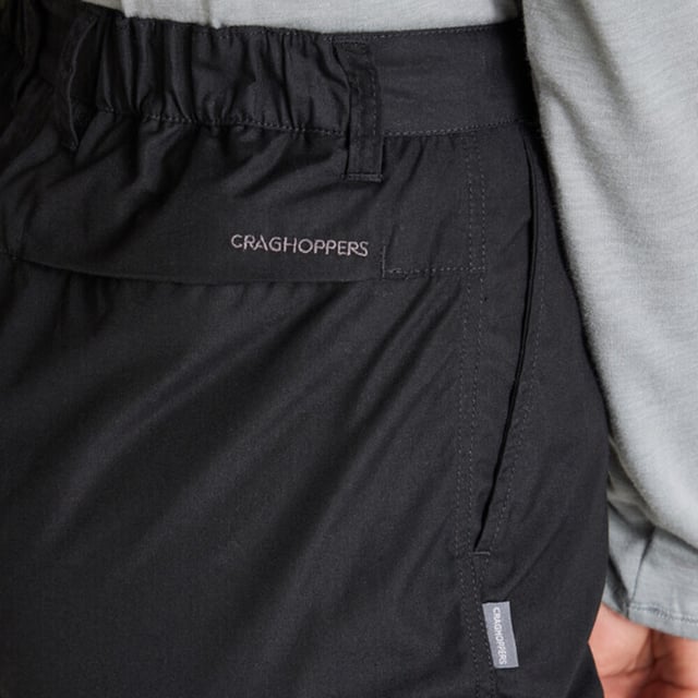 65% Recycled Polyester, 35% Cotton. Fabric: Peached. 160gsm. Design: Plain. Fastening: Button. Belt Loops, Heel Tape, Logo, Splashproof, Zip Fly. Fabric Technology: Durable, DWR Finish, EcoShield, Insect Repellent, NosiDefence, Sun Protective. Pockets: 2 Side Pockets, 1 Cargo Pocket, 1 Back Pocket. Waistline: Part Elasticated. Sustainability: Better Cotton Initiative. Sun Rating: UPF 40+.