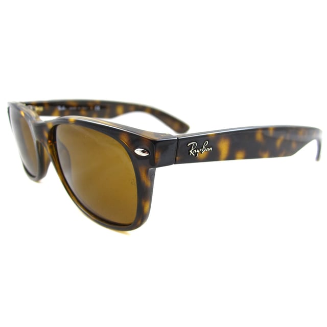 Ray-Ban Sunglasses New Wayfarer 2132 710 Light Havana Brown 52mm are an updated and slightly smaller interpretation of the Original Wayfarer. They feature a softer eye shape and sculpted temples that display the iconic Ray-Ban logo. The New Wayfarer 2132 are a versatile and playful choice that are available in countless colourways and the lightweight acetate frame is comfortable and easy to wear. The softer style of the 2132 suit more face shapes and is perfect for somebody that loves the Original Wayfarer design but is looking for a less dramatic look..