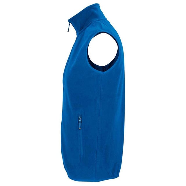 100% Recycled Polyester. Fabric: Microfleece. Design: Plain. 280gsm. Fabric Technology: Anti-Pilling. Bound Armholes, Tearaway Label, Unlined. Cuff: Elasticated. Neckline: High-Neck, Reinforced, Taped. Sleeve-Type: Sleeveless. Pockets: 2 Side Pockets, Zip. Fastening: Full Zip. Hem: Bound, Elasticated. Sustainability: ACCORD, Amfori, BSCI, Fair Wear Approved, GRS Certified, Made from Recycled Materials, Oeko-Tex Standard 100 Certified, PETA-Approved Vegan, REACH, SAC Approved. XS: 36 in. S: 38 in. M: 40 in. L: 42 in. XL: 44 in. XXL: 47 in. 3XL: 49 in. 4XL: 52 in. 5XL: 55 in.