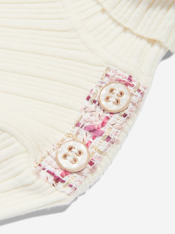 Introducing the Patachou Girls Ribbed Jumper in White, a luxurious addition to your little girl's AW2024 wardrobe. Exquisitely designed to blend comfort with elegance, this piece is a must-have staple: **Exclusively Ribbed Texture:** Crafted to elevate style with a comfortable, form-fitting design. **Pristine White Hue:** A versatile and timeless colour that enhances any outfit. **Premium Fabric:** Soft, breathable, and long-lasting qualities ensure comfort all day.Ensure your girl shines in sophistication with the Patachou Girls Ribbed Jumper. Ideal for stylish seasonal transitions!