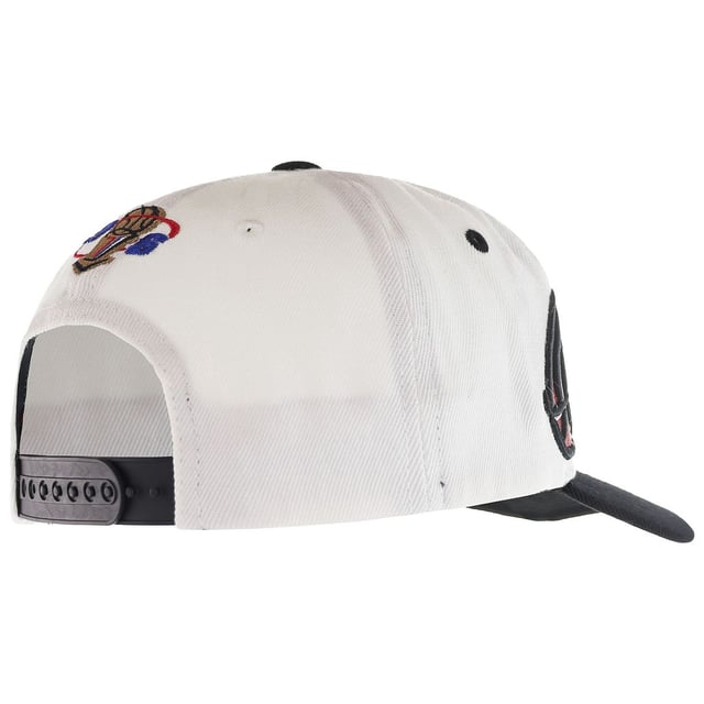 The Mitchell &amp; Ness '96 Chicago Bulls Champions Wave Men's White Cap is a stylish and commemorative piece of headwear that pays homage to one of the most iconic moments in NBA history. Mitchell &amp; Ness is renowned for its high-quality sports apparel and accessories, especially its collection of retro and vintage-inspired sports gear. Here are the key features and details of this cap:

Key Features:

 Championship Celebration:  The cap celebrates the Chicago Bulls' historic championship victory in 1996, a pivotal year in the franchise's history. This design pays tribute to the Bulls' domination of the NBA during the 1995-1996 season when they secured their fourth NBA championship.

 Team Affiliation:  This cap proudly displays the Chicago Bulls team logo, making it an ideal accessory for Bulls fans and enthusiasts. The Bulls' signature red and black colors are also incorporated into the design.

 High-Quality Construction:  Mitchell &amp; Ness is known for its commitment to quality, and this cap is no exception. It is crafted from durable materials to ensure longevity and comfort.

 Adjustable Fit:  The cap typically features an adjustable strap or snapback closure, allowing you to customize the fit to your head size and preferences.

 Structured Crown:  The cap's structured crown maintains its shape, giving it a classic and timeless look that's suitable for various occasions.

 Curved Brim:  The cap's curved brim not only adds to its style but also provides shade and protection from the sun.

 Officially Licensed:  Mitchell &amp; Ness is an officially licensed NBA merchandise manufacturer, so you can trust that you're getting an authentic product.

 Collectible Item:  Caps that commemorate specific championship victories and historic moments often become collectible items for sports fans and cap enthusiasts.

 Versatile Styling:  Whether you're wearing it to a Bulls game, during outdoor activities, or as a fashion statement, this cap can be incorporated into various outfits and styles.

 Gender-Neutral:  While it's labeled as a men's cap, caps like these are often considered gender-neutral, and anyone can wear them to show their team pride.

In summary, the Mitchell &amp; Ness '96 Chicago Bulls Champions Wave Men's White Cap is a stylish and commemorative accessory that celebrates the Chicago Bulls' historic championship victory in 1996. Its high-quality construction, adjustable fit, and officially licensed design make it a must-have for Bulls fans and collectors of sports memorabilia. Whether you're wearing it to the game or as a fashion statement, this cap allows you to showcase your Bulls pride with style while remembering a significant moment in NBA history.