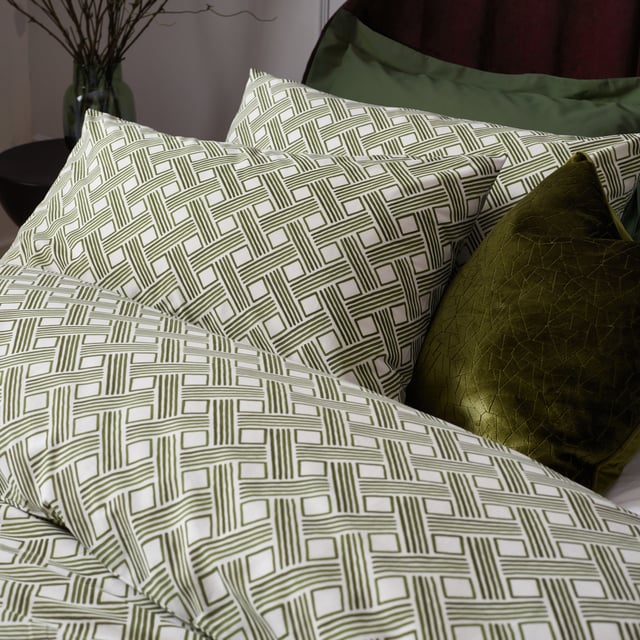 Inspired by modern, minimalist art, the Alexa duvet cover set is a softer alternative to geometric design. Featuring watercolour basket weave lines in earthy green tones, it will add warming, relaxing colour to a neutral interior. Printed on soft, cotton rich fabric, the design is featured on both sides. A timeless addition to your bedding collection! OEKO-TEX certifies this product® showing it has been sustainably made.