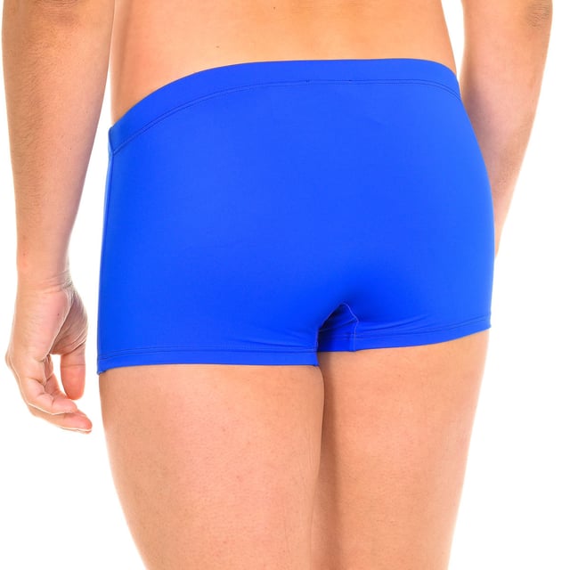 Boxer swimsuit. 
 Color blue 
 Elasticated waistband, adjustable with laces. 
 Brand print on the lower side. 
 Inner lining. 
 Seams in tone. 

 Composition: 
 - 78% Nylon - 22% Elastane. 

 Washing instructions: 
 - Wash at max. 30º. 
 - Do not use bleach. 
 - Allows dry cleaning. 
 - Do not iron. 
 - Do not use dryer. 

 Composition: 78% Nylon, 22% Elastane
 Care:
- Wash at max temperature. 30º.
 - Do not use bleach.
 - Allows dry cleaning.
 - Do not iron.
 - Do not use dryer.