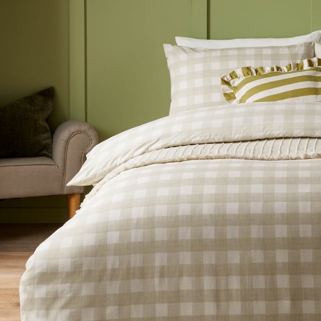 Transform your bedroom into an inviting sanctuary with the Hartsford Check Printed Duvet Cover Set. Crafted from a high-quality polycotton blend with a 144 thread count, this set offers a harmonious balance of softness and durability, ensuring restful nights for years to come. The timeless check print brings a subtle yet charming style to any interior, blending effortlessly with minimalist and classic aesthetics alike. Designed for those who value both style and practicality, this set combines understated elegance with everyday comfort, allowing you to express personality while creating an impression of effortless refinement in your home.