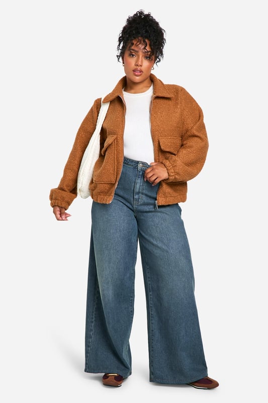 Add the finishing touch to your outfit with this outerwear piece from our women's plus size coats range. A wardrobe staple that's perfect for layering, this style provides added warmth and adds an extra something to your fit. Made with added fabric for the perfect fit, this piece is a whole vibe - just throw on over your fave outfit and you're sorted. Whether you choose a plus size denim jacket or keep things cosy in winter with a plus size teddy coat we've got the hottest coats for curvy girls that are always on-trend. Style: Bomber JacketNeckline: Collared