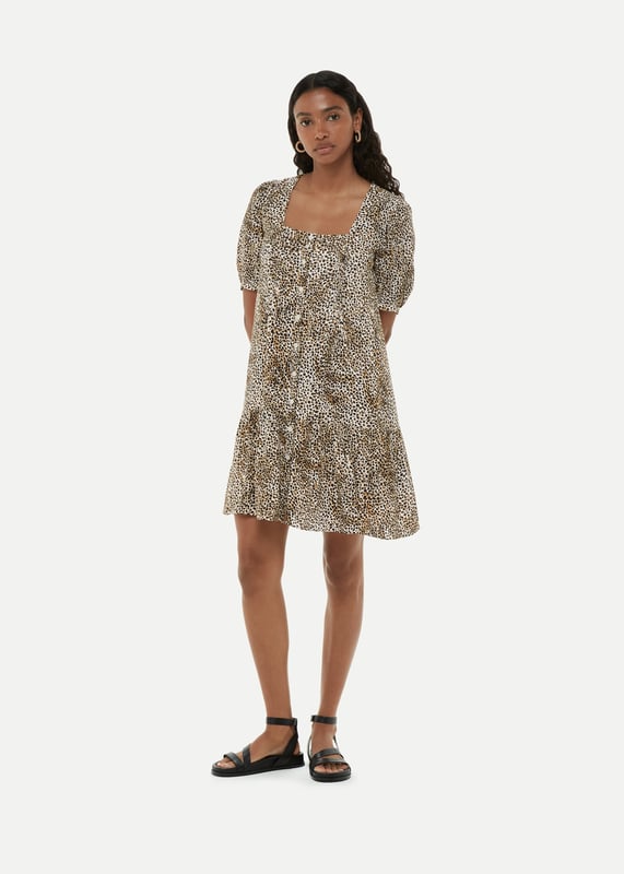 Experience elegance with the Ink Spot Midi Dress - perfect for any special occasion.
