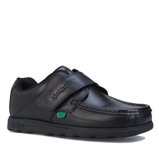 Junior Boys Kickers Fragma Strap Leather Shoe in black.- Moccasin style upper.- Touch and close double fastener. - Padded ankle collar. - Signature green logo tabs.- Kickers branding to the top strap.- Stitched detail.- Durable rubber outsole.- Leather upper  Textile lining  Synthetic sole. - Ref: 114863