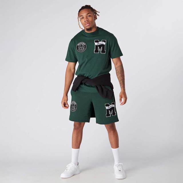 Mens Mercier Academy Shorts in green.- Elasticised waistband.- Open pockets.- Applique logos on leg.- Regular fit.- 65% Cotton  35% Polyester.- Ref: MERC150GREEN