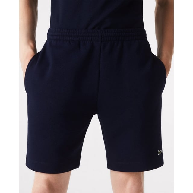 PRODUCT REF. GH9627-00 Efficient. Durable. Comfortable. An iconic, performance-enhancing essential that's comfortable enough to relax in. Regular fit, straight cut: Unrestricted freedom of movement. Drawstring waist: An adjustable waistband for optimum comfort. Back pocket with piping: Practical and functional. Embroidered crocodile on the front: Lacoste-typical performance. Brushed organic cotton fleece: Long-lasting comfort during sports. Main material: cotton (84%), polyester (16%) / pocket lining: cotton (100%)