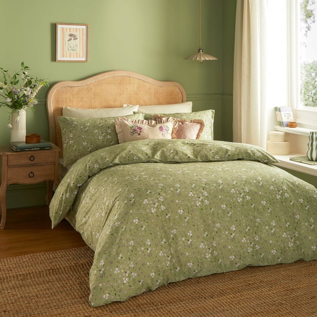 Transform your bedroom into a serene retreat with the Bronte Floral Duvet Cover Set. Crafted from 100% cotton and featuring a 144-thread count, this duvet cover combines comfort with timeless elegance. The classic English garden ditsy print showcases delicate lilac forget-me-nots and subtle foliage, offering a refined touch that speaks to lovers of nature and understated beauty. The same exquisite design graces both sides, allowing it to stand alone as a statement piece. With Bronte, experience the perfect blend of sophistication and natural allure that invites tranquillity and style into your living space. 200 x 200cm
