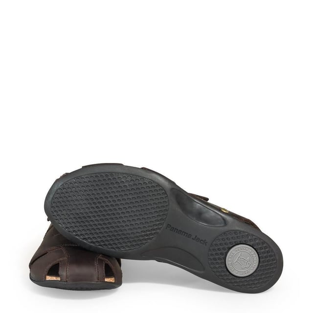 Step into comfort and style with our Panama Jack Men's Leather Sandals, the Fletcher Basic. Crafted for the adventurous soul, these half-open shoes offer a perfect blend of functionality and fashion. Experience unmatched comfort and durability with the Velcro Closure and natural greased nappa leather construction. Enjoy a luxurious feel with leather lining and anatomical insole, providing support and cushioning for all-day wear. Navigate any terrain with confidence, thanks to the flexible and durable TR rubber sole, ensuring stability and grip on outdoor adventures. Bullet Points: Velcro Closure for easy and adjustable fitNatural greased nappa leather construction for durability and styleLeather lining for luxurious comfortAnatomical insole for added supportFlexible and durable TR rubber sole for stability on various surfaces