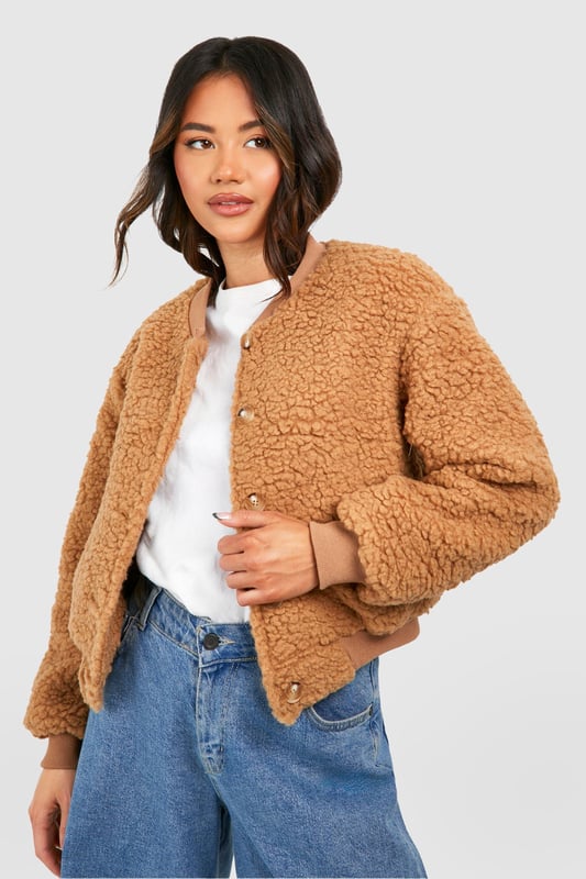 Teddy Faux Fur Bomber Jacket Keep things casual but always on-trend with a piece of outerwear perfection, the bomber jacket. A light jacket featuring a gathered, ribbed waistband and matching cuffs, a bomber jacket is versatile, timeless, and the perfect way to edge up your casual wear. Wear your new women's bomber jacket with a shirt and stripe joggers for the hottest look of the moment: sports luxe, or layer a varsity jacket over a t shirt dress for a fresh new-season look.Style: Faux Fur CoatFabric: BorgSleeve Length: Long Sleeve
