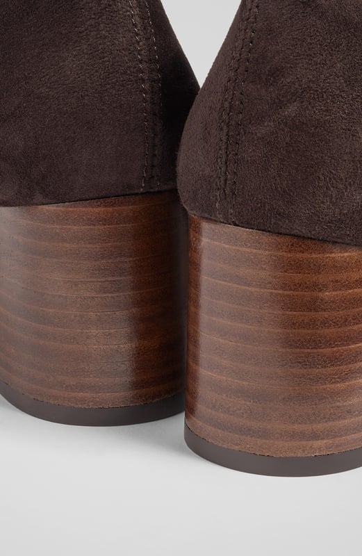 LK Bennett Davina Knee Boots, Chocolate Stretch boots are an LKB signature, and our Davina knee-high boots offer a sleek look and a comfortable fit in velvety-soft suede. Crafted in Spain from chocolate brown stretch suede, they have a square toe, a slim fit and a 60mm stacked block heel. Pull them on under winter skirts and dresses when it's time to up the winter layers.