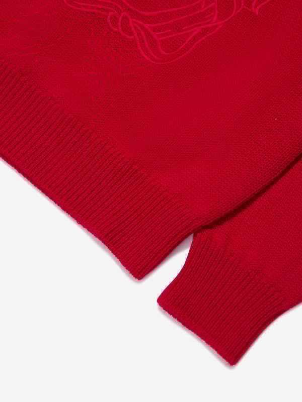 Luxury Italian label Versace use captivating Greek abstracts to create fun and playful aesthetics. This boys red sweatshirt embodies the Italian label's vibrant craftsmanship and innovative outlook. Made in refined material, this long-sleeved soft knit jumper has been depicted with a Medusa embroidery at the front, a ribbed crewneck, hem and cuffs. A mythological statement both captivating and unique, he will be obsessed.  Medusa Kids Embroidery Crewneck Elasticated Hem and Cuffs Outer Composition: 100% Pure Virgin Wool Embroidery: 100% Viscose Do Not Wash Do Not Bleach Do Not Tumble Dry Cool Iron Dry CleanVersace Size : Child's Height4Y: 41" / 104 cm 5Y: 43.5" / 110 cm 6Y: 45.5" / 116 cm 8Y: 50.5" / 128 cm 10Y: 55" / 140 cm 12Y: 60" / 152 cm 14Y: 64.5" / 164 cm