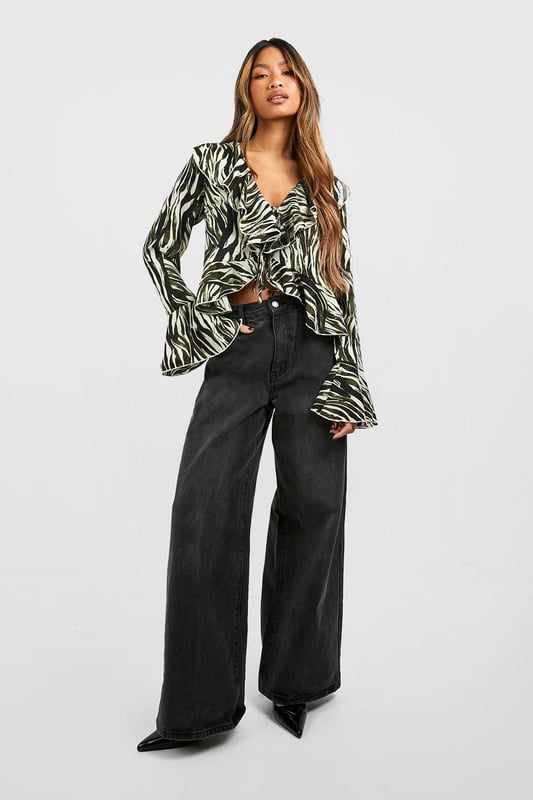 A loose-fitting, lightweight garment with a feminine feel, a blouse is the ultimate wardrobe staple that never goes out of style. Floaty, chic, and far from basic, go from day to night with this classic piece. Whether you choose a floral blouse with jeans for a low-key vibe or drop jaws with a classic satin blouse and trousers, you'll be reaching for this style season after season. Seen in updated prints and classic neutrals, we're talking minimal effort, maximum payoff.Style: BlouseDesign: AnimalFabric: PolyesterLength: RegularNeckline: V NeckSleeve Length: Long SleeveModel's height: 173cm / 5'8"