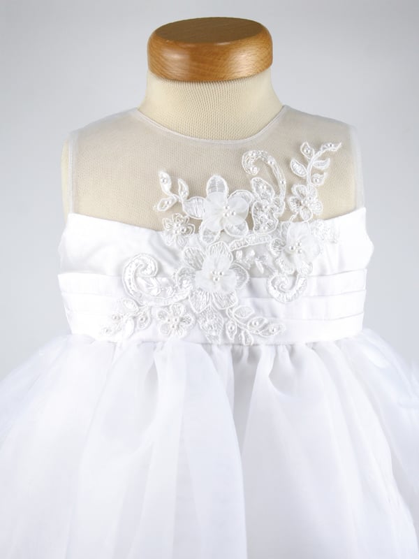 ROSIE by Heritage, is another one of our stunning special occasion dresses using fabric that has been sourced from Japan.
It has a delicate organza fabric section over the shoulders and around the neck, making it almost invisible from a distance.
The body is made from our popular 'mock silk' with pin tucks around the waist. We then added a guipure lace flower shape panel over the top that has been hand finished with organza flowers and pearl beads.
The skirt has net layers underneath creating a lovely full princess like shape. Perfect for twirling at any given moment, as long as they're not walking down the Aisle behind the bride at the time.  Perfect for parties though ;)
The back of the dress has a long sash to tie a large bow and has a back zip fastening.
It's lined in 100% soft cotton lawn fabric so it is soft against the child's skin and keeps them cool.
 
The dress comes to you on a padded satin hanger and protected in a Heritage keepsake bag.
This beautiful ROSIE white dress is ideal for Christenings, Baptisms, Flower girl dress or any other special occassion! Team it up with our VALENTINA cardigan in white and you're ready to wow your friends and relatives! Kodak moment
 
Outer - 100% Polyester White (mock silk and Organza)
Lining - 100% cotton
Hand wash or Dry clean only