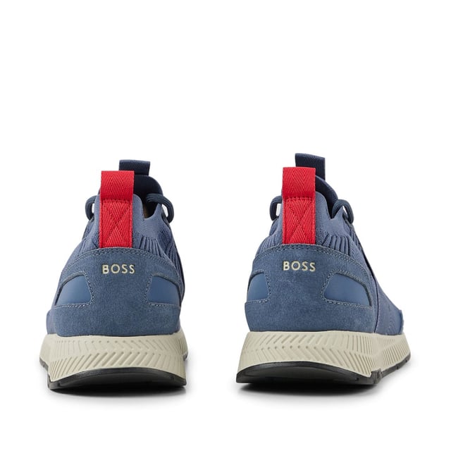 Mens BOSS Titanium Running Trainers in blue.- Stretchy knitted upper.- Lace up fastening.- Pull tabs on the collars and tongues.- Signature BOSS lettering to the heels  tongues and lateral sides.- Rubber sole.- Ref: 50470596-438