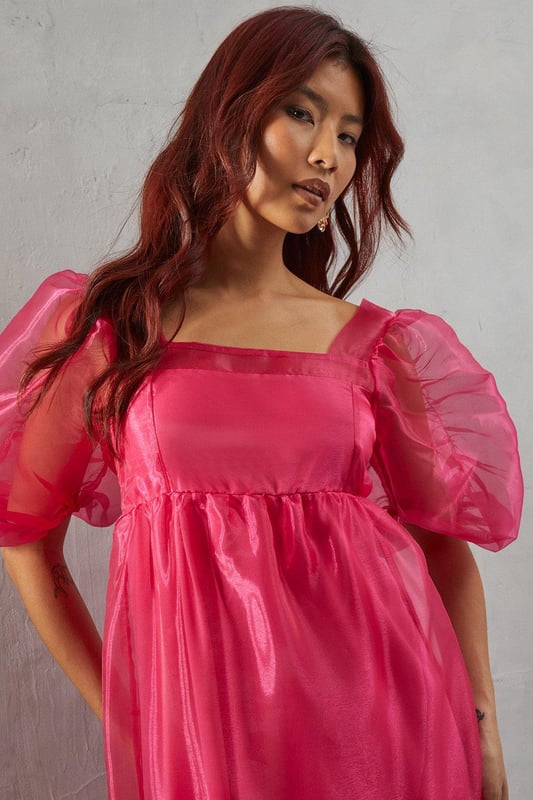 Introducing our Organza Square Neck Midaxi Dress, a stunning piece that exudes elegance and sophistication. This dress features intricate detailing that adds a touch of femininity, while the long sleeves provide a modest yet stylish look.  Whether you're attending a wedding or a special event, this dress is sure to make you feel confident and glamorous.