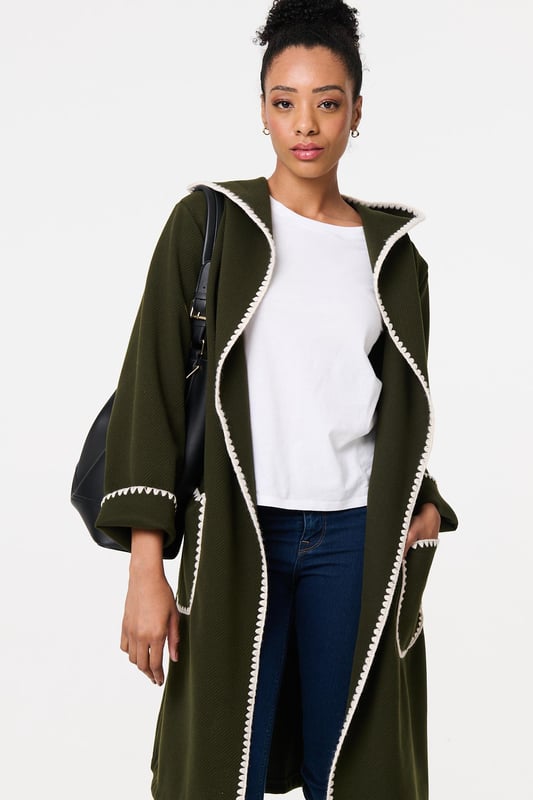 Throw on an extra layer in style with this tie up coat. It's finished with a decorative blanket stitch and front pockets, as well as an adjustable waist tie. The longline thigh length hem will look great layered over trousers, jeans or a skirt, so you can wear it with practically any outfit.