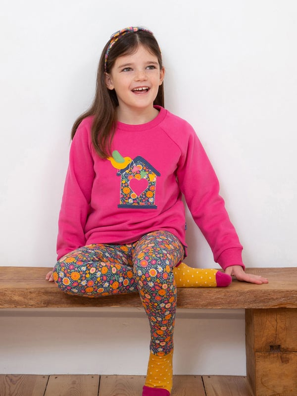 100% organic cotton | Proud to be certified by Control Union to the Global Organic Textile Standard (GOTS) | Bird appliqué design | Rose pink | Brush back sweat fabric | Coconut button raglan sleeve opening (up to and including size 3 years) | Long sleeved | Ribbed neckline | Ribbed cuffs | Made in Turkey | Machine washable at 40 degrees, or at 30 degrees to be kinder to the planet