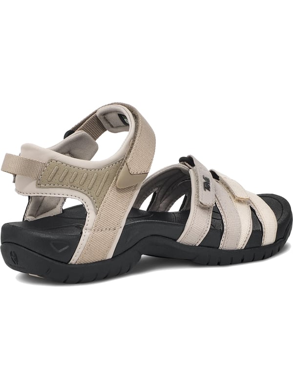 Teva sandalen Beleef het avontuur in stijl en comfort in deze trekking sandalen voor dames. De verstelbare klittenbandsluitingen zorgen voor een pasvorm op maat en een stevige grip. Met een dempende EVA-tussenzool en geïntegreerde Shoc Pad bieden deze sandalen optimaal comfort bij elke stap. Het voorgevormde voetbed past zich aan je voet aan en biedt extra ondersteuning op ruw terrein. Een robuuste buitenzool zorgt voor stabiliteit en duurzaamheid. De subtiele labelbelettering rondt het ontwerp stijlvol af. Perfect voor buitenavonturen, wandelingen of dagelijks gebruik. Deze sandalen bieden de ideale combinatie van functionaliteit en modieus design.