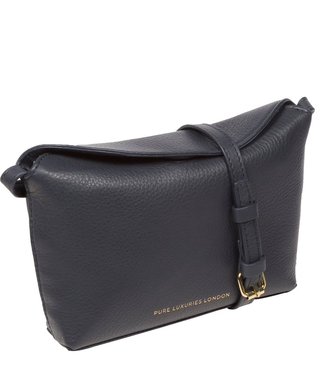 The 'Lolo' cross body bag from the Pure Luxuries Marylebone collection is handcrafted from high-quality, genuine Nappa leather with a natural super-soft touch. The bag is secured by a magnetic closure which opens to reveal a 100% cotton-lined interior and includes two slip pockets. Features gold-coloured metal fittings alongside the adjustable slim leather strap, with a maximum drop length of 65cm. The Pure Luxuries logo is embossed in gold foil for a beautifully simple finishing touch.