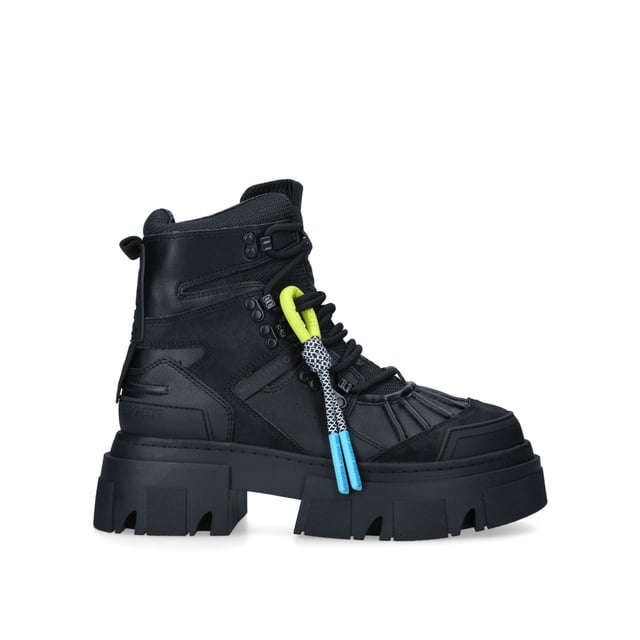 The Trekker Pumped Hiker boot features iconic branding across the upper. KG Kurt Geiger logo printed on ribbed textile with print stitch detailing can be seen at the tongue as well as a black rubber monocle on the heel.