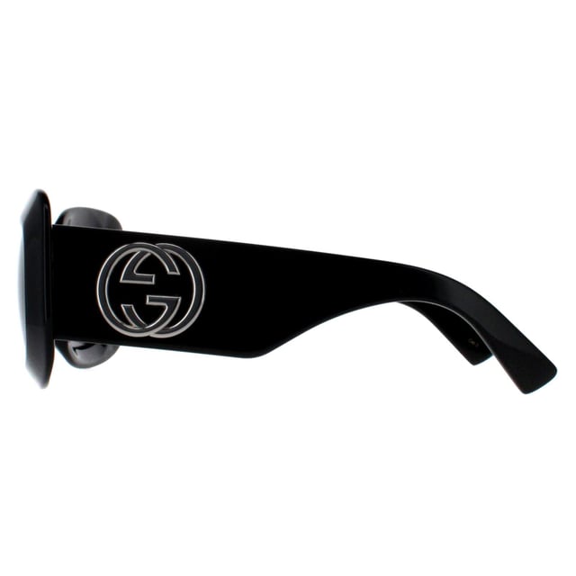 Gucci Square Womens Black with Silver Grey GG1695S  Sunglasses are perfect for those who crave a statement piece that reflects luxury and confidence. They feature a bold, square frame design that merges contemporary sophistication with a touch of retro flair. The temples are adorned with Gucciâ€™s signature double G logo, highlighting the brandâ€™s dedication to detail and heritage. Crafted with top quality materials, the lenses offer full UV protection, ensuring that wearers stay stylish and protected in the sun.