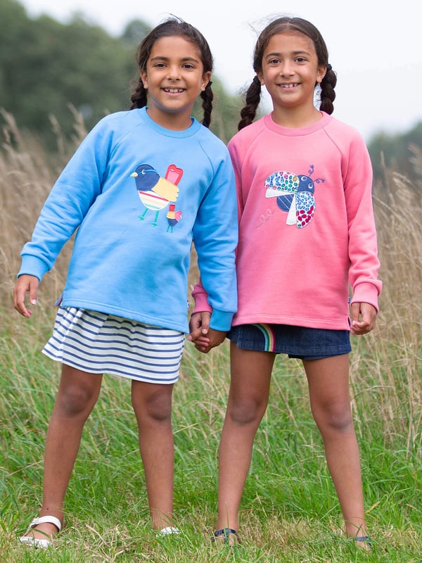 Come fly with me! Our ladybird sweatshirt is sure to brighten any day and is the perfect companion for days spent adventuring and exploring. Stylish and practical with a lovely ladybird ditsy appliqué on super soft pink lemonade brush back sweat fabric. Coconut button raglan sleeve opening up to and including size three years.
