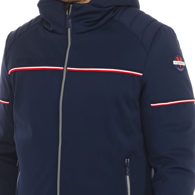 Waterproof jacket Vuarnet.
 Adjustable hood.
 Front zipper opening.
 One zipper pocket on the sleeve.
 Two zippered hand pockets
 Two internal zipper pockets.
 Brand logo on one sleeve.
 Composition: 82% Polyamide, 18% Elastane
 Care:
Wash at maximum temperature 30º.
 Iron at low temperature.
 Do not use dryer.
 Do not use bleach.
 Do not dry clean.