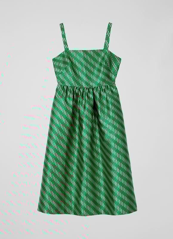 A dress that says 'belle of the ball', Elodie is a beautiful reimagition of our hero Olsen skirt, but in dress form. Crafted from voluminous, bouncy fabric with a green, black, white and metallic geometric weave, Elodie has a square neckline, slim shoulder straps, a gathered waist, side pockets and a puffy shape falling to just below the knee. Wear with green satin platforms to perfectly match, or style more casually with simple ballet flats - she's versatile, and very good fun.