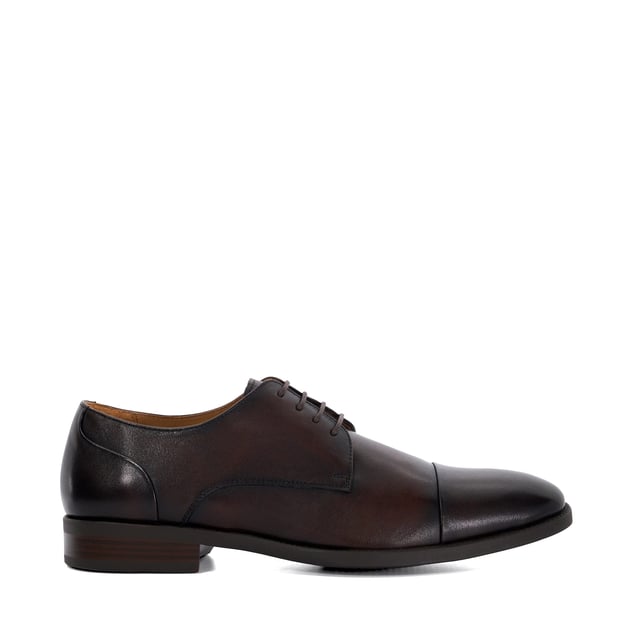 Dune Mens Suffix - Leather Toe Cap Lace Up Derby Important date in the diary? Our timeless lace-up Derby has been designed for those who need to maintain a polished appearance without compromising on comfort. Crafted from smooth, burnished premium leather and boasting a low-block heel and toe cap, this versatile design is guaranteed to enhance every smart outfit. Thanks to the soft cushioning and ergonomic design that supports your feet all-day- long, this hybrid profile will allow you to transition seamlessly from meetings to social events. The flexibility in the sole allows for natural foot movement, reducing strain during long hours of we