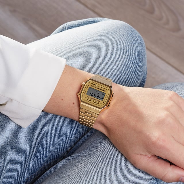 This Casio Casio Collection Digital Watch for Unisex is the perfect timepiece to wear or to gift. It's Gold  Rectangular case combined with the comfortable Gold Stainless steel watch band will ensure you enjoy this stunning timepiece without any compromise. Operated by a high quality Quartz movement and water resistant to 3 bars, your watch will keep ticking. This is a perfect elegant and casual watch for you, it's a great gift for family or friends -The watch has a calendar function: Day-Date, Stopwatch, Alarm, 24 hour display, Light High quality 20 cm length and 21 mm width Gold Stainless steel strap with a Fold over clasp Case diameter: 35x38 mm,case thickness: 9 mm, case colour: Gold and dial colour: LCD