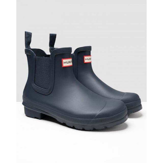 The New And Improved Hunter Original Chelsea Wellington Boot Has An Even More Optimum Fit To Maximise All-day Comfort And Style. Ready For The Changing Seasons In The Countryside As Well As Rainy Days In The City, Each Welly Boot Is Handcrafted From Natural Rubber And Vulcanised For Superior Protection. Retaining The Iconic Silhouette Of A Traditional Chelsea, It Features Elasticated Gussets And Has A Nylon Pull-tab For An Easy On And Off. In A Classic Dark Blue Matte With An Eye-catching Logo On The Front, These Waterproof Outdoor Chelseas Are A Wet Weather Wardrobe Essential.