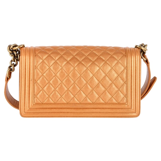 VINTAGE, RRP AS NEW
Elevate your ensemble with the timeless allure of the Chanel Quilted Medium Boy Flap Bag in sumptuous brown lambskin leather. This chic shoulder bag epitomizes luxury with its diamond-quilted pattern and opulent feel. The bag showcases an aged gold chain link shoulder strap adorned with a leather shoulder pad, providing both comfort and style. The focal point is the aged gold Boy Chanel CC press lock that adds a touch of glamour. Opening the front flap reveals a matching fabric interior that includes a convenient patch pocket for organization. Perfect for adding a touch of refinement to any outfit, this Chanel bag is an iconic piece that exudes sophistication and elegance in every detail.

with Dust bag

Chanel Quilted Medium Boy Flap Bag in Brown Lambskin Leather
Condition: Excellent
Signs of wear: No retail tag, No visible sign of wear., 
Packaging: Dust bag
Color: Brown | ochre
Material: Leather | Lambskin leather
Size: One Size
Measurements: Width: 80; Height: 150; Length: 260; Handle drop: 250; Strap length: 600
SKU: NAPPUGBBA385936W