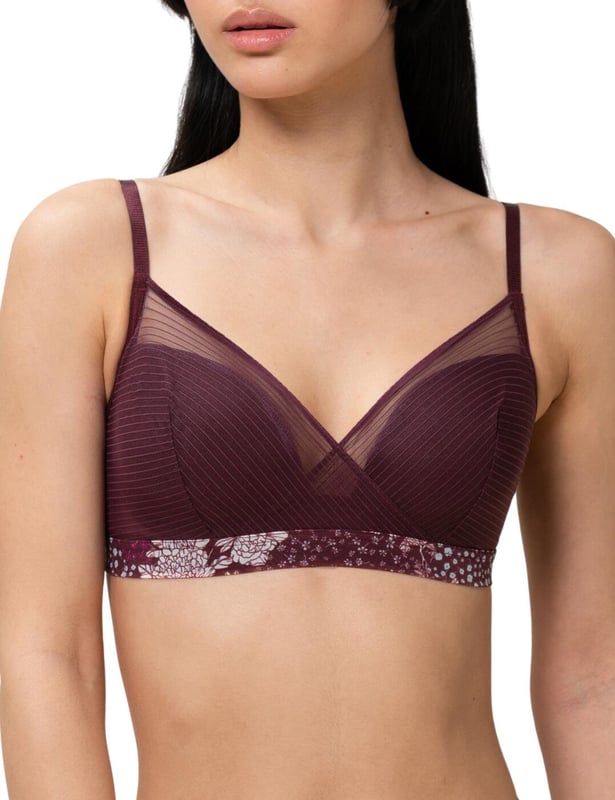 This stylish padded bralette comes from the Lavish Spotlight collection by Triumph. The padded cups offer comfort and support, whilst the tulle fabric drapes over each cup, joining to the band underneath the alternate cup creating a cross styling, with added fine line details along each mesh section. The band is decorated with a feminine floral print and offers a hook and eye closure. The mesh joins at the rear to complimentary detailed floral lace. The adjustable straps help for personalisation of fit and no underwiring is styled for optimal comfort.  Floral printed band, Complimentary lace at the rear, Adjustable straps, Hook and eye closure, Padded cups, Non-Wired, Fine detailed tulle mesh, Matching items available, Country of Origin: India, Composition: 46% Polyamide | 46% Polyester | 8% Elastane, Listed in UK sizes.   Bralette