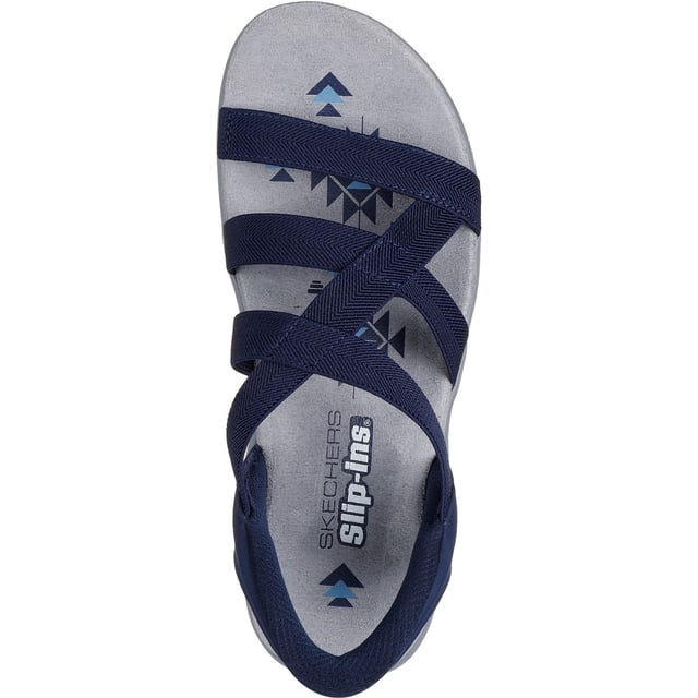 Geniet van zonnige dagen in luchtig comfort met Skechers Hands Free Slip-ins: Reggae Slim - Stretch Flex. Deze sandaal is ontworpen met ons hielkussen en heeft een bovenwerk van stretchstof met een hielstuk en een voetbed met kussentjes.
