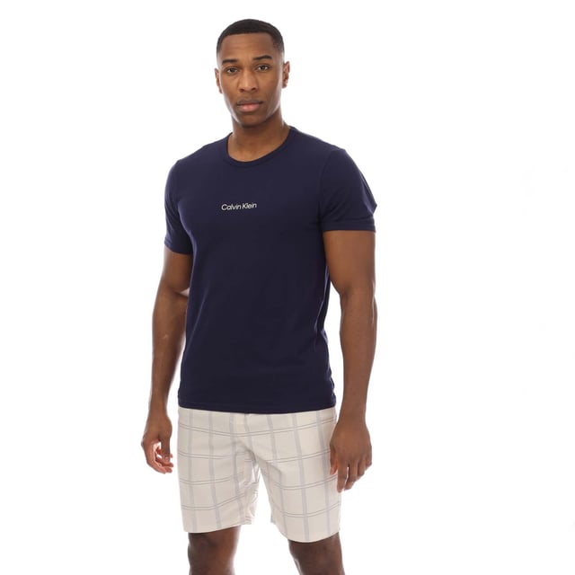 Mens Calvin Klein Shorts Pyjama Set in blue.T-Shirt:- Crewneck.- Short sleeves.- Printed logo.- 57% Cotton  38% Polyester  5% Elastane.Shorts:- Branded elastic waistband.- Side pockets.- Relaxed fit.- 98% Cotton  2% Elastane.- Ref: 000NM2183EO1M