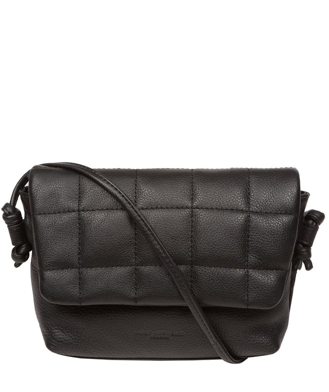The 'Zoey' cross body bag from the Pure Luxuries London Marylebone Collection is handcrafted from high-quality, genuine Nappa leather with a natural super-soft touch. The fold-over top features an eye-catching quilted design and is secured by a magnetic press stud. The interior is lined with 100% cotton and includes two card slots, to help keep maintain an organised bag. Comes with an adjustable slim leather strap, with a drop length of 65cm. The Pure Luxuries logo is embossed in gold foil for a beautifully simple finishing touch.