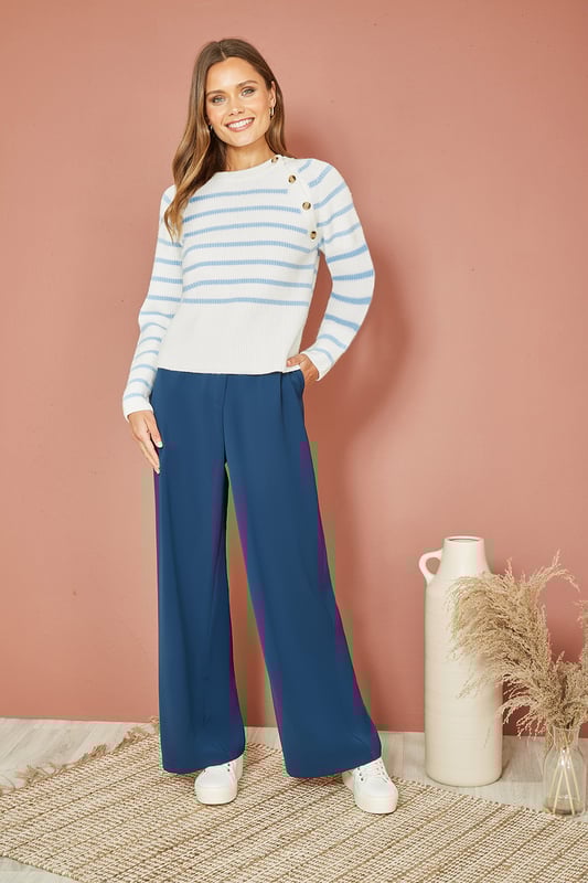 Gorgeous soft pastels for the new season all wrapped up in a cosy, soft and comfortable jumper. In a white and blue stripe, with  button details running from collar to sleeve. Style this with a pair of wide jean trousers for effortless chic.