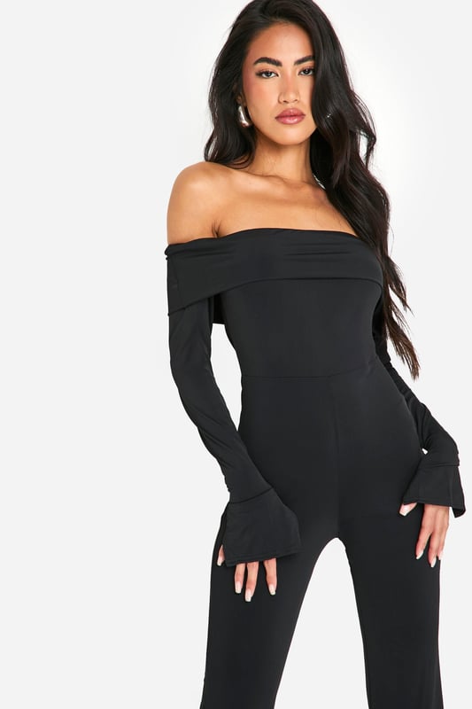 On the hunt for the perfect new-season piece? This bardot jumpsuit is just for you. Sitting off the shoulder for a flattering fit, an off the shoulder jumpsuit is the perfect addition to your summer collection. Curve accentuating, shoulder enhancing, and super easy on the eye, this style seriously brings the heat. From classic black bardot jumpsuits with ruffle detailing to white bardot jumpsuits perfect for long summer days, we've got you covered. Just add strappy sandals and you're ready to go. Style: UnitardFabric: SlinkyLength: RegularNeckline: BardotSleeve Length: Long Sleeve