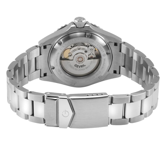 An accessory to success. A distinctive, Swiss-made timepiece is always a sound investment. Artfully reminiscent of the famed New York City skyline, each watch in the Gevril Wall Street Collection commands attention with a stainless steel, architectural design. The new 39mm unidirectional rotating bezel frames sapphire-doomed, anti-glare crystal. Detailed to perfection, a magnified lens showcases luminous indices and hands on a contrasting dial. Form never suffers to function: each watch is water resistant for up to 200 meters and features a stainless steel bracelet with folding deployment closure. Available in a series of sleek dial colorways, the Wall Street Collection makes a strong statement.

Gevril 4769B Men's Wall Street Swiss Automatic Watch

Gevril Men's Swiss Automatic Watch from the Wall Street Collection
39mm Round Stainless Steel Satin and Polished Case, Unidirectional rotating Blue/Red bezel
Black Enamel dial, date at 3 o'clock Magnified Lens, Luminous indices on the dial, Luminous hands
Exhibition Screw down Case back, Screw down Crown with Gevril Logo
316L Stainless Steel Satin and Polished Bracelet With Deployment Buckle
Anti-reflective Sapphire Crystal
Water Resistant to 200 Meters/20 ATM
Swiss Automatic Movement, Sellita SW200-1
