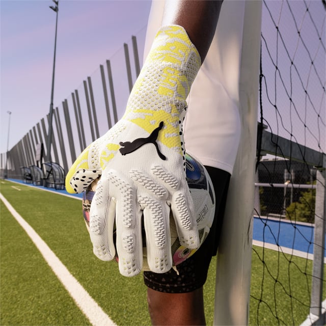 PRODUCT STORY: The new FUTURE Ultimate NC is engineered to give your hands maximum freedom of movement and support when you need it on the pitch. Inspired by goalkeeper wrist taping rituals the gloves comes with a specific, re-designed wrist support construction. Using different elasticities and thicknesses in the knit of the backhand, each section of the glove gets its specific treatment to improve the performance even further. DETAILS: Negative cut for tight fit; 3D knitted backhand; Thumb wrap for increased ball contact; Silicone tape; PUMA Cat Logo on back.