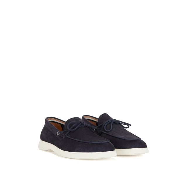 A slip on shoe with suede uppers featuring decorative tassels across the vamp in dark blue suede and all over dark blue stitch details. Two silver branded eyelets situated on the outstep and instep with the signature BOSS logo embossed on the outstep of the heel. A textured rubber midsole in off white with a branded and textured rubber undersole in off white.