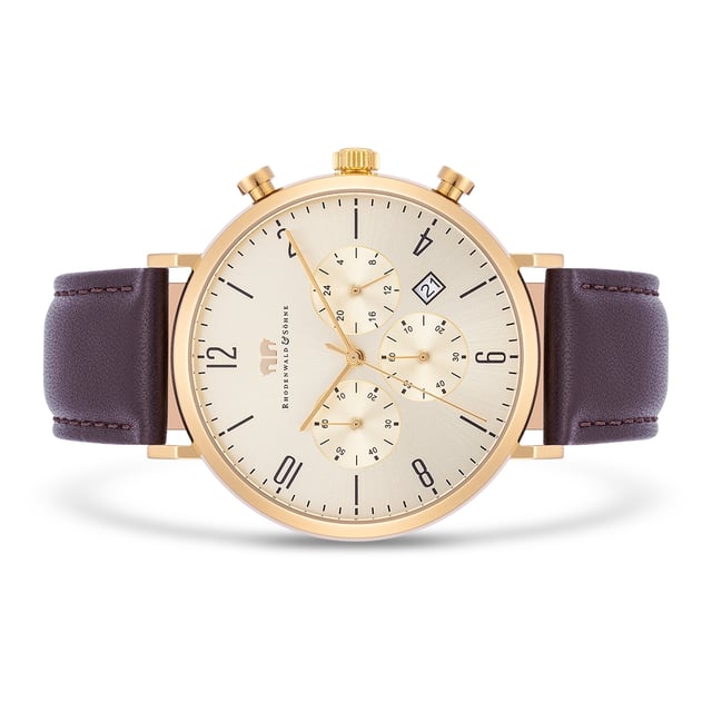 The timeless men's watch from the Rhodenwald & Söhne manufactory is a harmonious connection of the tricompax design of classic chronographs with the elegance of a subtle dress watch. The functions of 24-hour display, stopwatch and date are integrated in a harmonious tone-in-tone dial-a perfect companion not only for a suit, but also for casual jeans. The model convinces with a robust stainless steel housing with IP coating in yellow gold, filigree sticker and a precise quartz train. A soft real leather bracelet with seam and thorn clasp perfect the premium equipment.
