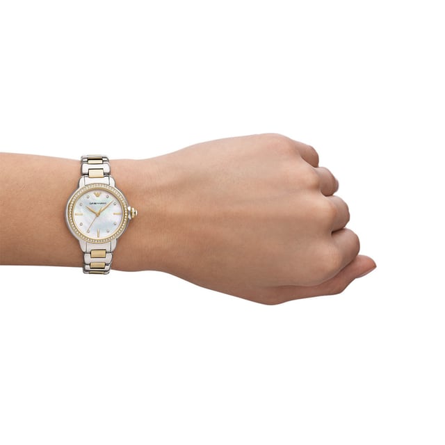 This Emporio Armani Mia Analogue Watch for Women is the perfect timepiece to wear or to gift. It's Multicolour 32 mm Round case combined with the comfortable Multicolour Stainless steel watch band will ensure you enjoy this stunning timepiece without any compromise. Operated by a high quality Quartz movement and water resistant to 5 bars, your watch will keep ticking. This elegant, fashionable watch set with beautiful stones is a perfect gift for New Year, birthday,valentine's day and so on High quality 19 cm length and 15 mm width Multicolour Stainless steel strap with a Deployment clasp Case diameter: 32 mm,case thickness: 9 mm, case colour: Multicolour and dial colour: Mother of pearl