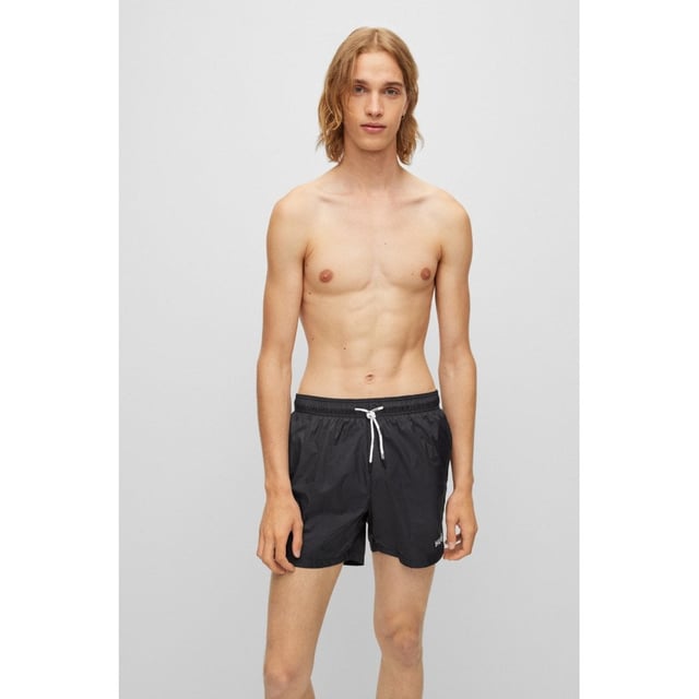 Signature swim shorts with full lining, by HUGO. Crafted in lightweight fabric with quick-drying performance, these swim shorts are detailed with branded drawcords and a contrasting HUGO logo.
Elastic waistbandDrawstringPockets bottom front: Side pocketsMedium length
100% Polyamide, Lining: 100% Polyester
50469312